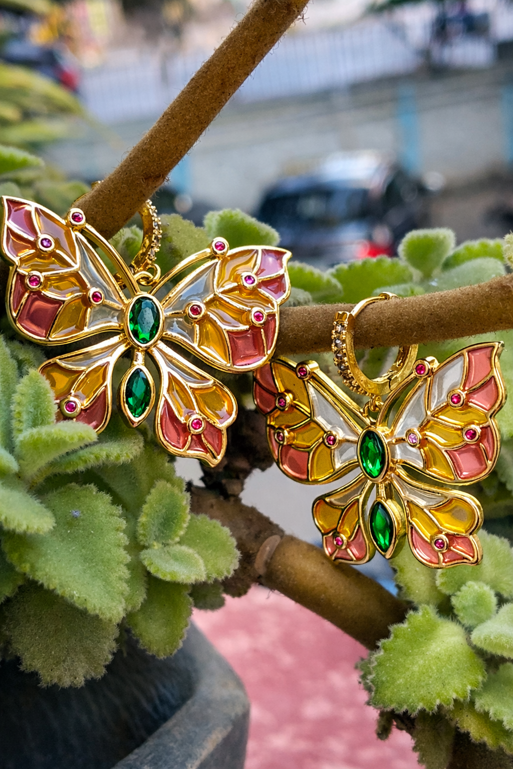 Butterfly earrings with stained glass effect and CZ accents.