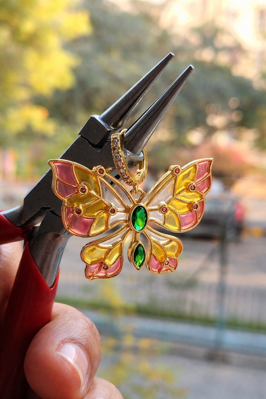 Butterfly earring with stained glass effect and CZ accents.
